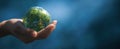 The hand holds a miniature globe symbolizing global unity and environmental care..AI generated image Royalty Free Stock Photo