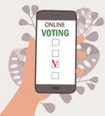 Hand holds mobile phone. On screen application with online voting. The concept of choice, presidential election, questionnaires