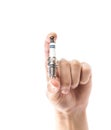The hand holds a new iridium spark plug. Close up. Isolated on a white background Royalty Free Stock Photo