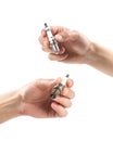 The hand holds a new and used iridium spark plugs. Close up. Isolated on a white background