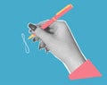 A hand holds a pen and writes. Trendy halftone vector collage.