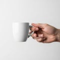 Is minimalist, focusing on the contrast between the mug and the neutral Royalty Free Stock Photo