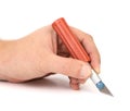 Hand holds plastic Craft Knife Royalty Free Stock Photo