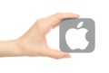 Hand holds popular operating system logo