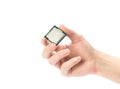 The hand holds a powerful desktop processor. Close up. Isolated on a white background Royalty Free Stock Photo