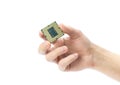 The hand holds a powerful desktop processor. Close up. Isolated on a white background Royalty Free Stock Photo