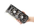 The hand holds a powerful video card with two fans. Close up. Isolated on a white background Royalty Free Stock Photo