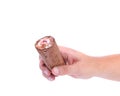 Hand holds roll of chocolate ice cream. Royalty Free Stock Photo