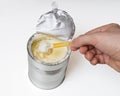 Hand holds scoop with baby milk formula Royalty Free Stock Photo