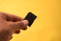 Hand holding a single Black SD Card for camera isolated background Royalty Free Stock Photo