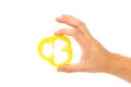 Hand holds slice of yellow pepper. Royalty Free Stock Photo
