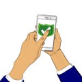 Hand holds smart phone with green shield and a finger touches the screen. Royalty Free Stock Photo