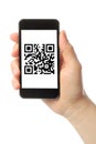 Hand holds smart phone with QR code