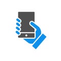 Hand holds a smarthone colored icon. Social network activitiy, blogging, feedback symbol Royalty Free Stock Photo