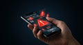 A hand holds a smartphone displaying multiple red warning icons with