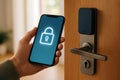 A hand holds a smartphone with padlock icon to unlock a smart door with electronic lock system Royalty Free Stock Photo