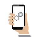 Hand holds smartphone update gears on display