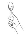 Hand holds spoon. Kitchen accessory. Cutlery spoon for cooking and eating liquid dishes, soups, cereals, gravies, first courses