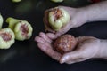 Hand holds stuffing for stuffing and bell pepper