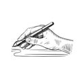 Hand holds the stylus for drawing on the graphic tablet
