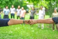 Hand holds together in the community in the garden / park