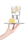 Hand holds tray with sparkling water soda drink Royalty Free Stock Photo