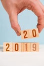 The hand holds two dice with numbers 20. The concept of changing the year from 2019 to 2020. Closeu p Royalty Free Stock Photo