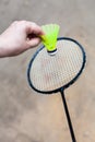 Yellow shuttlecock over badminton racquet Royalty Free Stock Photo
