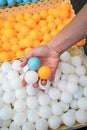 Hand holiding ping-pong balls. Royalty Free Stock Photo