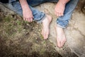 Hand of homeless beggar asks for alms, help, money and food on concrete. Beggar begging on the street. Poverty concept. Royalty Free Stock Photo