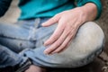 Hand of homeless beggar asks for alms, help, money and food on concrete. Beggar begging on the street. Poverty concept. Royalty Free Stock Photo