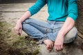 Hand of homeless beggar asks for alms, help, money and food on concrete. Beggar begging on the street. Poverty concept. Royalty Free Stock Photo