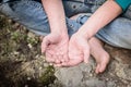 Hand of homeless beggar asks for alms, help, money and food on concrete. Beggar begging on the street. Poverty concept. Royalty Free Stock Photo