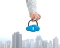 Hand hooking cloud shape lock with city view Royalty Free Stock Photo