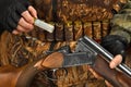 Hand of the hunter removed discharged shell from shotgun Royalty Free Stock Photo