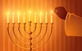 Hand igniting candles on the menorah Royalty Free Stock Photo