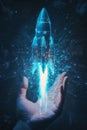 A hand illuminated by soft blue light holds a rocket ship icon with digital network lines radiating Royalty Free Stock Photo