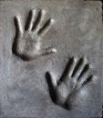 Hand imprint in mortar. Royalty Free Stock Photo