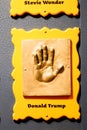 Hand imprints with inscription in concrete of President of the United States of America Donald Trump