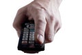 Hand with infrared remote control. Isolated on wh Royalty Free Stock Photo