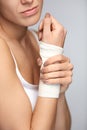 Hand Injury. Beautiful Woman With Bandage On Hand Feeling Pain