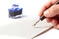 Hand with Ink Pen Over a Mail Envelope Royalty Free Stock Photo