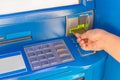 Hand insert credit card to ATM bank cash machine for withdraw mo Royalty Free Stock Photo