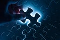 Hand insert jigsaw, conceptual image of business
