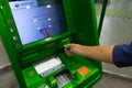 Belgorod, RF, 10.07.2019. Hand inserting ATM credit card into bank machine to withdraw money. Royalty Free Stock Photo