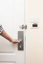 A hand inserting keycard in the electronic lock Royalty Free Stock Photo