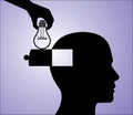 Idea in Head - A hand inserting an light bulb idea