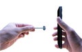 Hand Inserting SIM Ejector Tool into Smartphone Royalty Free Stock Photo