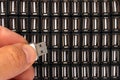 Hand inserting USB flash drive in one of many sockets Royalty Free Stock Photo
