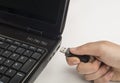 Hand inserting usb memory stick Royalty Free Stock Photo